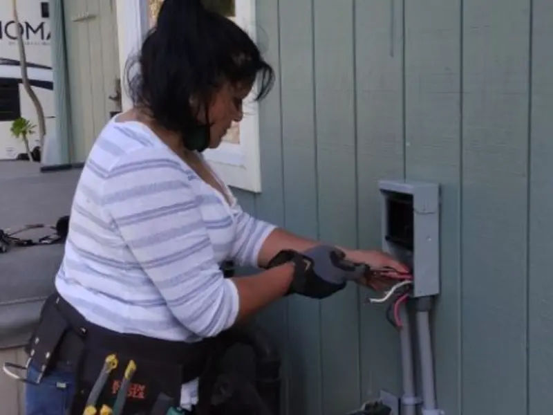 Licensed electrician wiring an exterior subpanel in Beckett Ridge