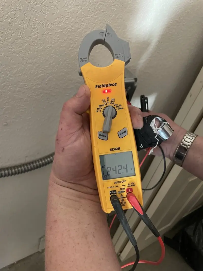 Voltage testing with clamp meter during Aluminum Wiring Replacement in Beckett Ridge
